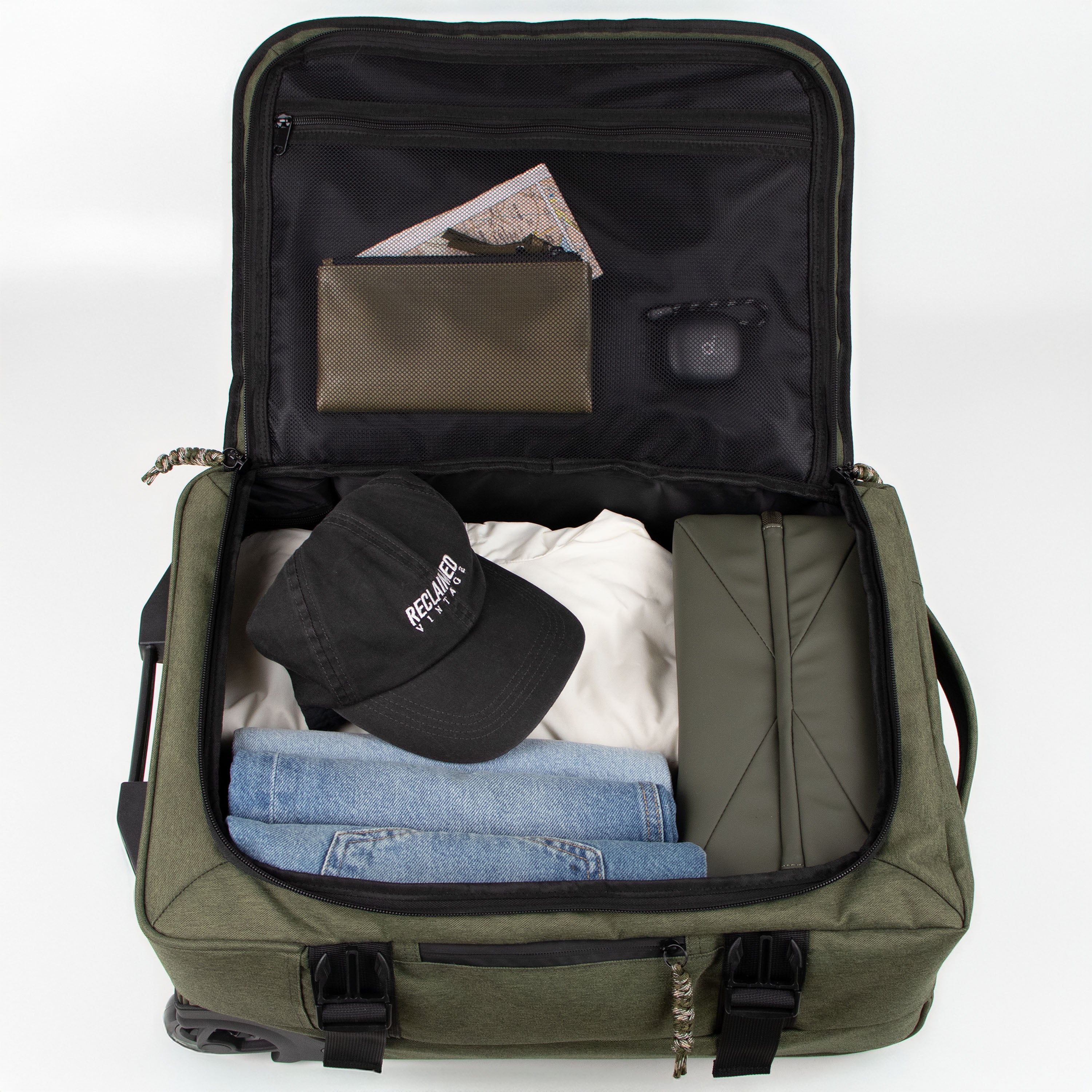 Video laden: Rolltop-Rucksack mit geöffneter Innenaufteilung – zeigt Laptopfach, Handyfach und Stiftehalter beim Packen.