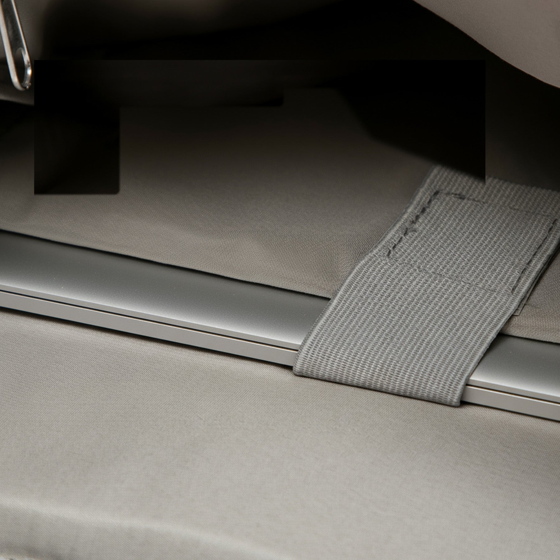 Load video: Rolltop backpack with open interior divider – shows laptop compartment, cell phone pocket and pen holder when packing.