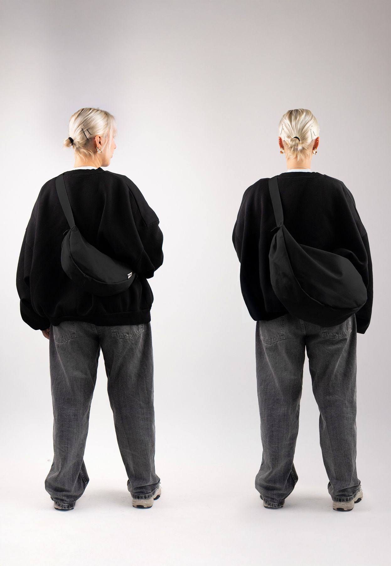 Moon bag schwarz XL inuse indoor frau steht mit dem ruecken zur kamera weite jeans
