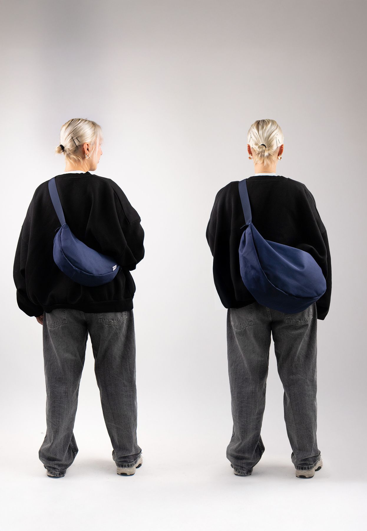 Moon bag blau XL inuse indoor frau steht mit dem ruecken zur kamera weite jeans