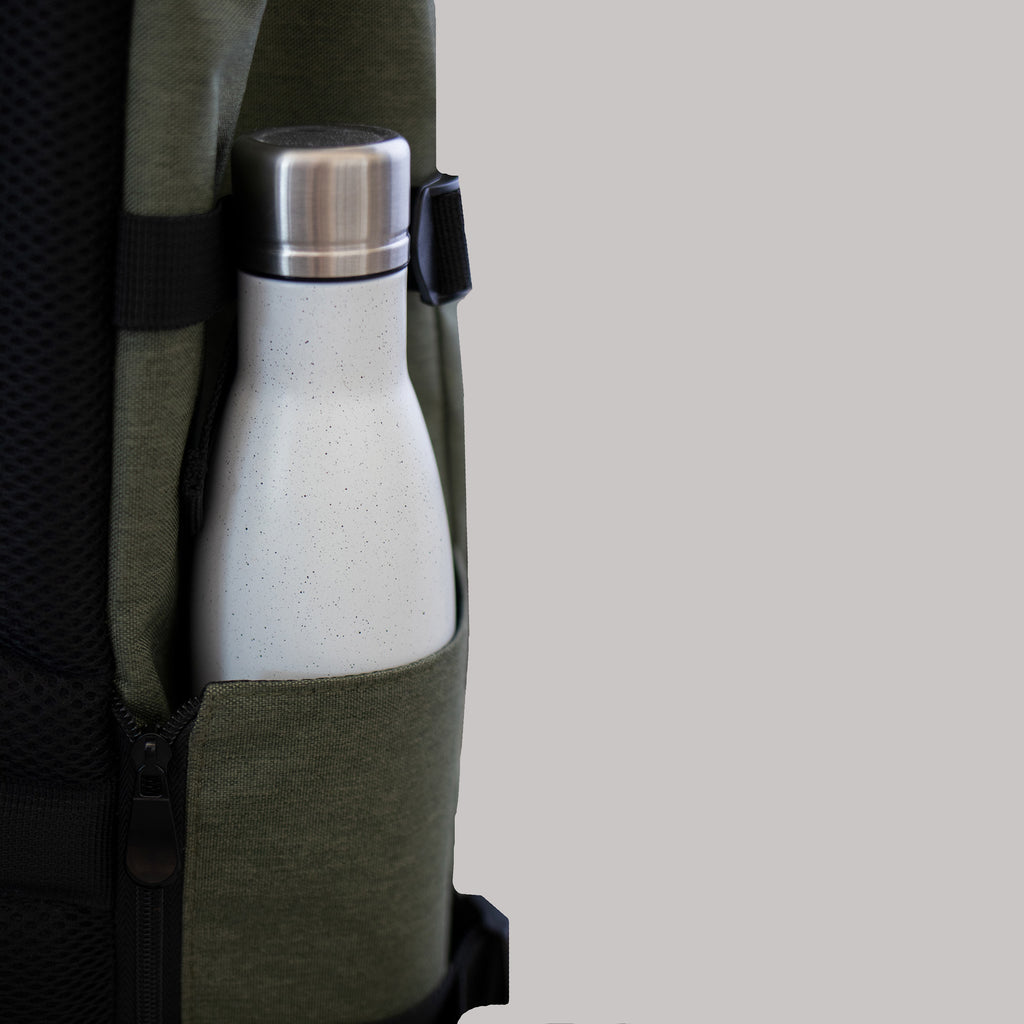 Bottle Compartment of the Sons of Aloha backpack with a white bottle inside