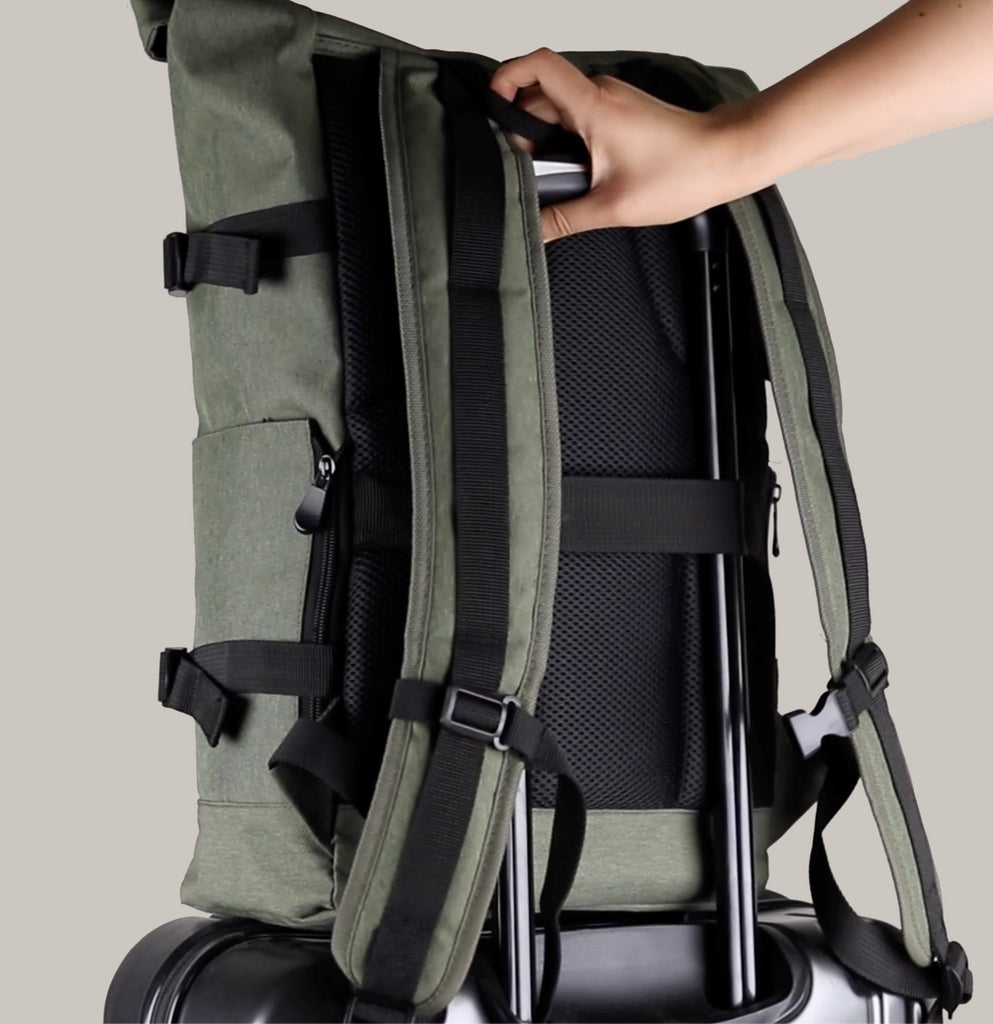 Olive-green Sons of Aloha backpack attached to a Trolley